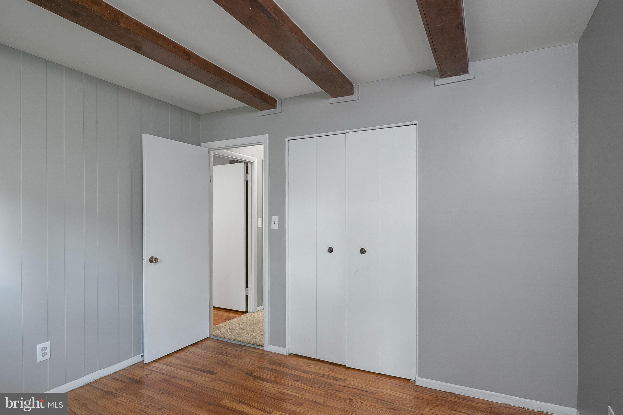 3947 Setonhurst Road Baltimore, MD 21208 - Photo 17 of 30 a view of a hallway with wooden floor