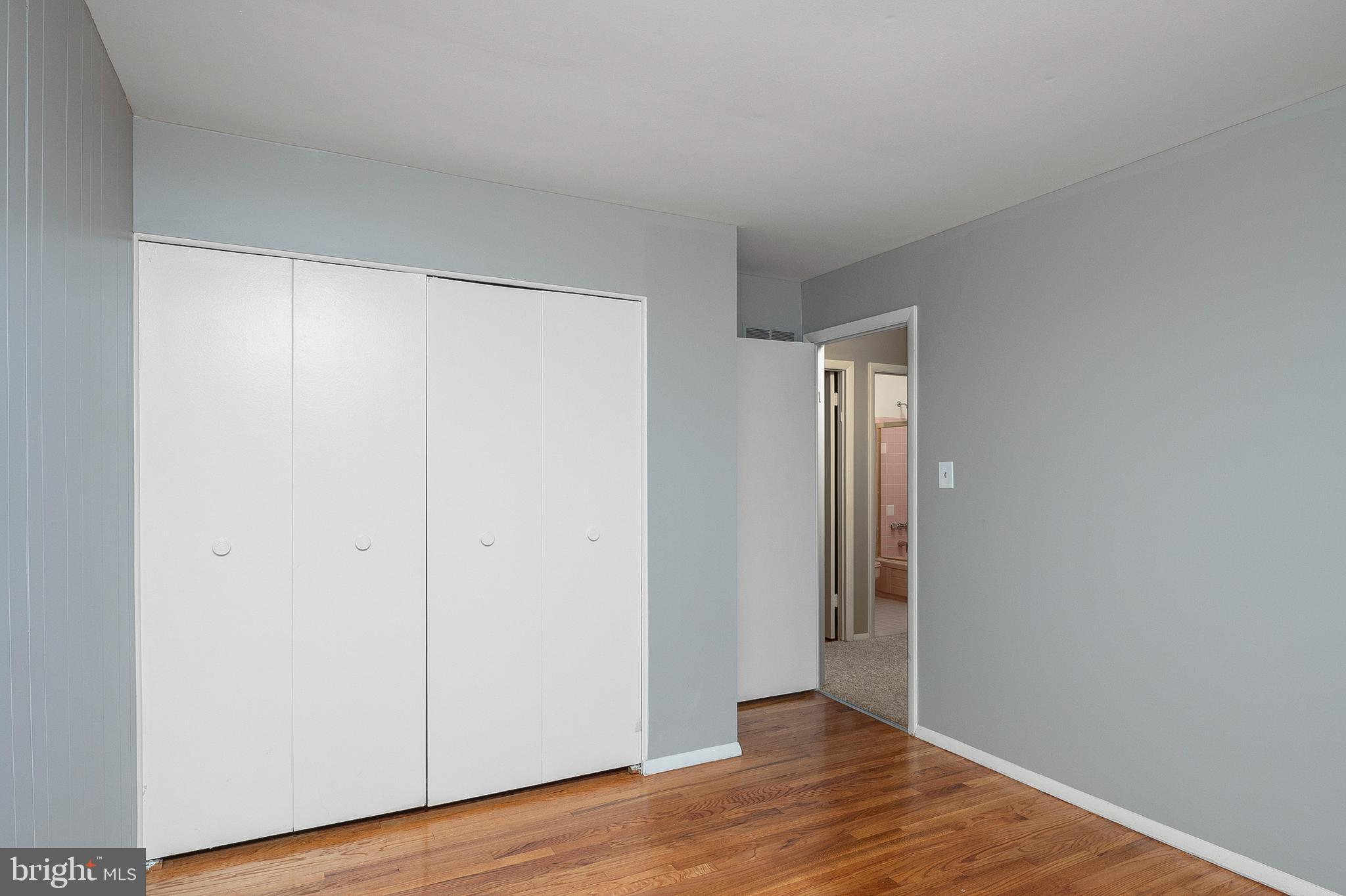 3947 Setonhurst Road Baltimore, MD 21208 - Photo 21 of 30 a view of an empty room with wooden floor