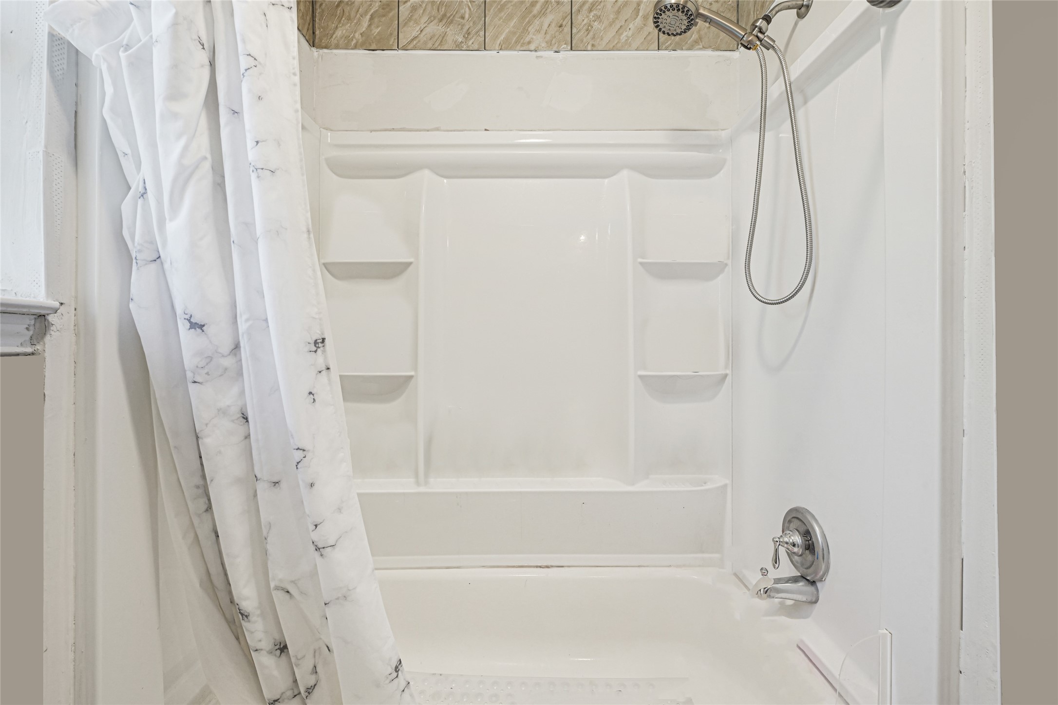 4529 Perry Street Houston, TX 77021 - Photo 12 of 20 a bathroom with a glass shower door