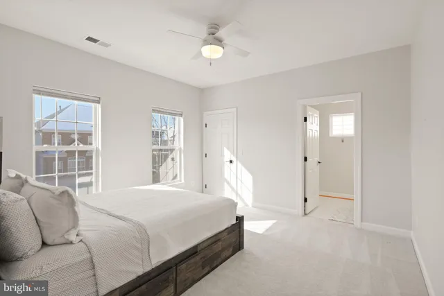 a bathroom with a toilet and shower