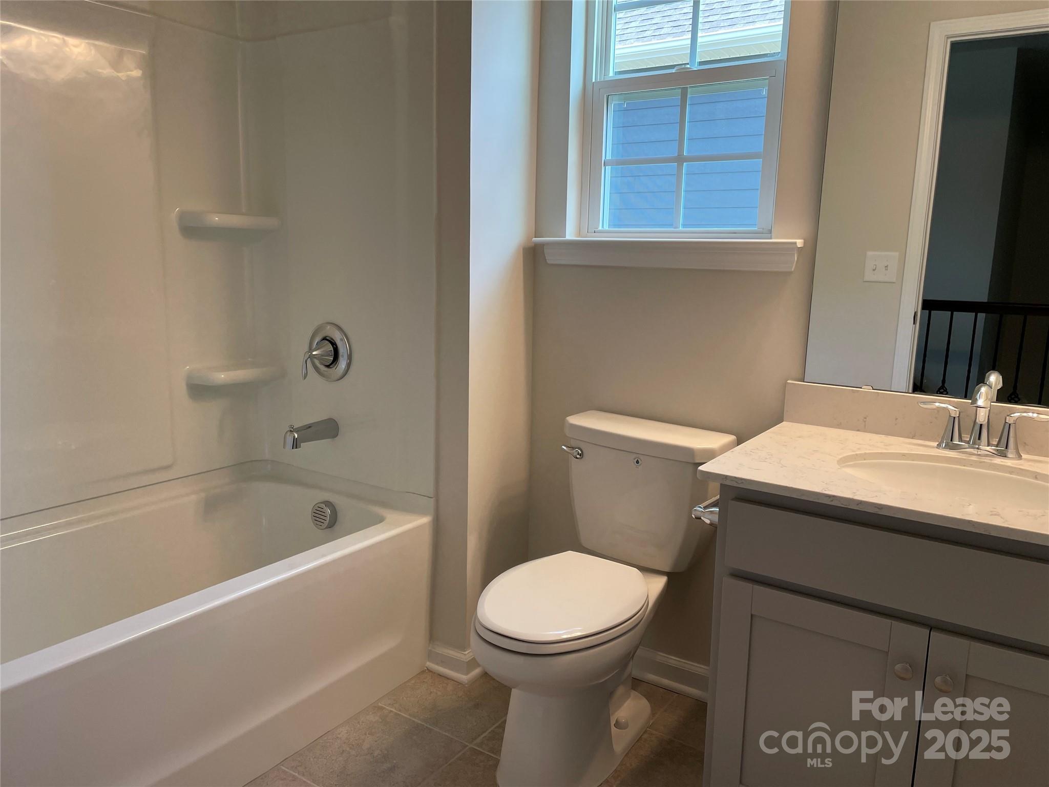 17618 Snug Harbor Road, Unit LOT75 Charlotte, NC 28278 - Photo 11 of 33 a bathroom with a sink a toilet and bathtub