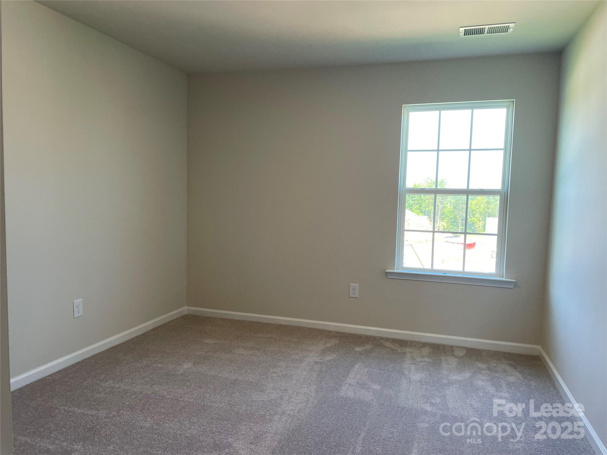 17618 Snug Harbor Road, Unit LOT75 Charlotte, NC 28278 - Photo 12 of 33 an empty room with a window