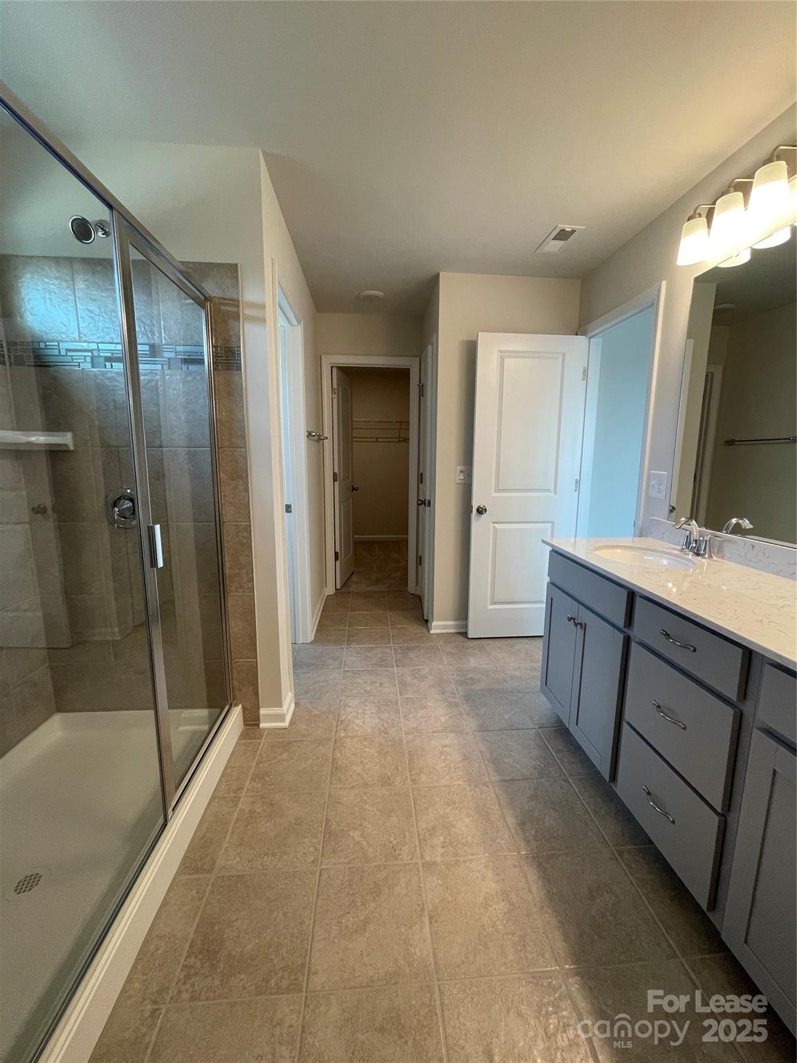 17618 Snug Harbor Road, Unit LOT75 Charlotte, NC 28278 - Photo 13 of 33 a bathroom with a double vanity sink mirror and shower