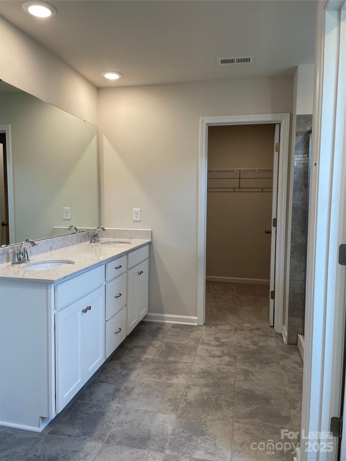 17618 Snug Harbor Road, Unit LOT75 Charlotte, NC 28278 - Photo 15 of 33 a spacious bathroom with a double vanity sink a mirror and a shower
