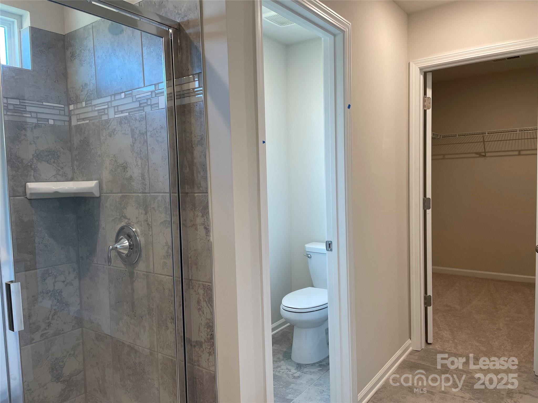 17618 Snug Harbor Road, Unit LOT75 Charlotte, NC 28278 - Photo 17 of 33 a bathroom with a toilet and a shower