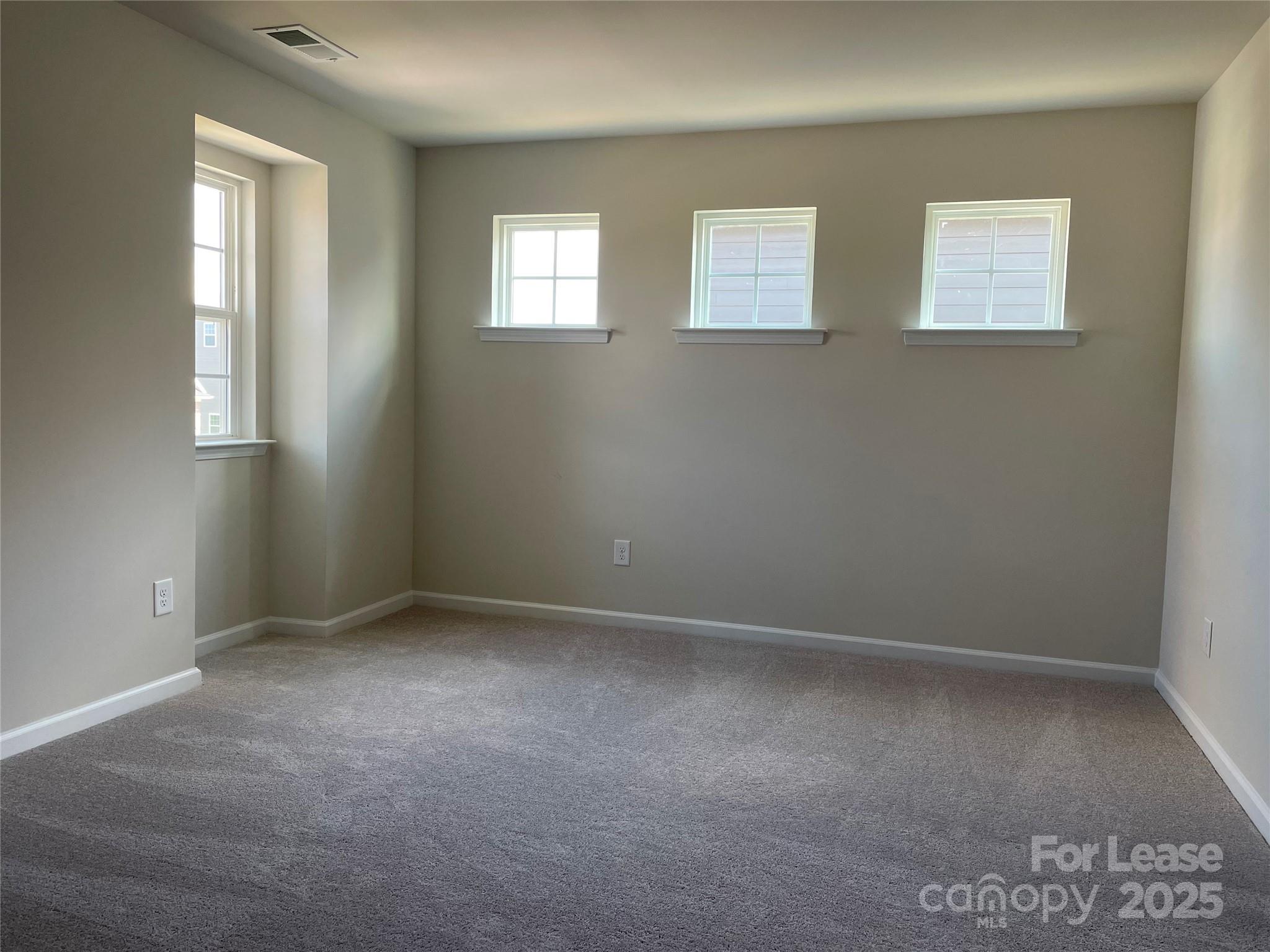 17618 Snug Harbor Road, Unit LOT75 Charlotte, NC 28278 - Photo 20 of 33 an empty room with windows