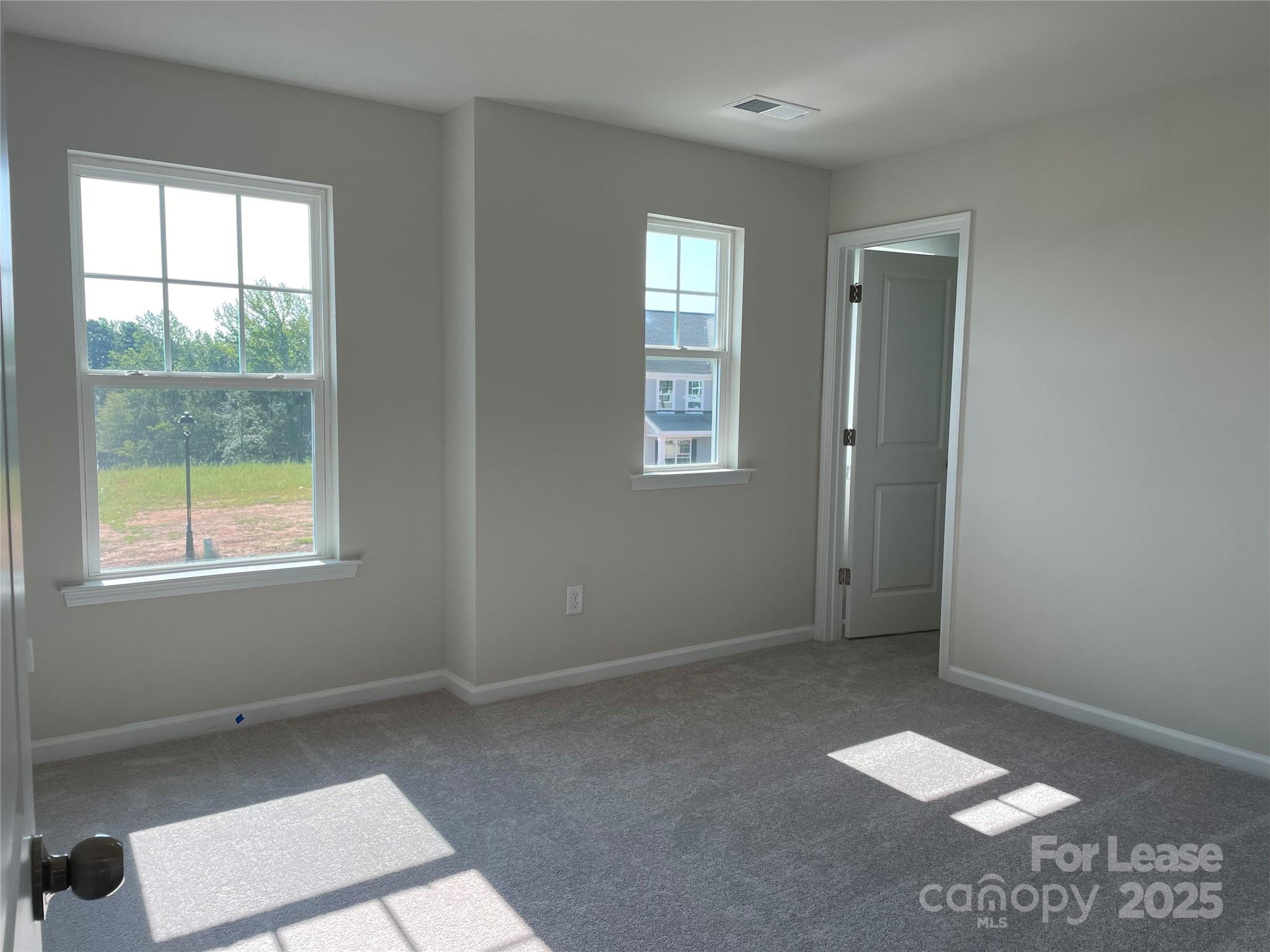 17618 Snug Harbor Road, Unit LOT75 Charlotte, NC 28278 - Photo 21 of 33 a view of an empty room and window