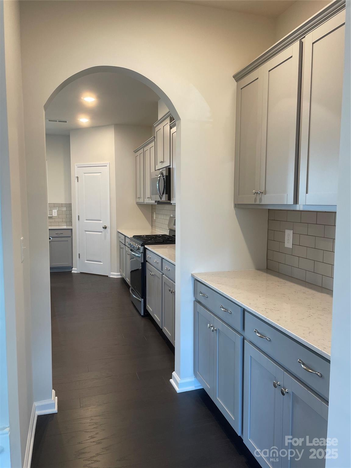 17618 Snug Harbor Road, Unit LOT75 Charlotte, NC 28278 - Photo 6 of 33 a kitchen with a sink and cabinets