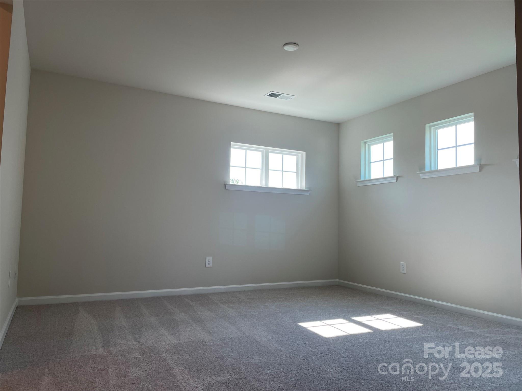 17618 Snug Harbor Road, Unit LOT75 Charlotte, NC 28278 - Photo 8 of 33 an empty room with windows