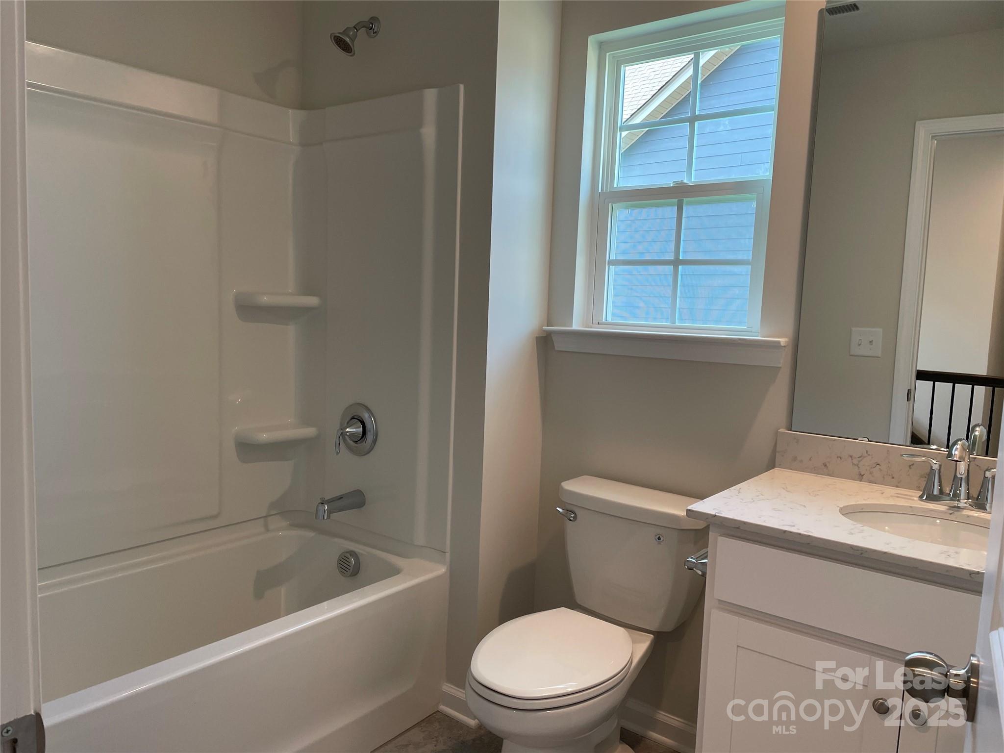 17618 Snug Harbor Road, Unit LOT75 Charlotte, NC 28278 - Photo 10 of 33 a white toilet sitting next to a bath tub