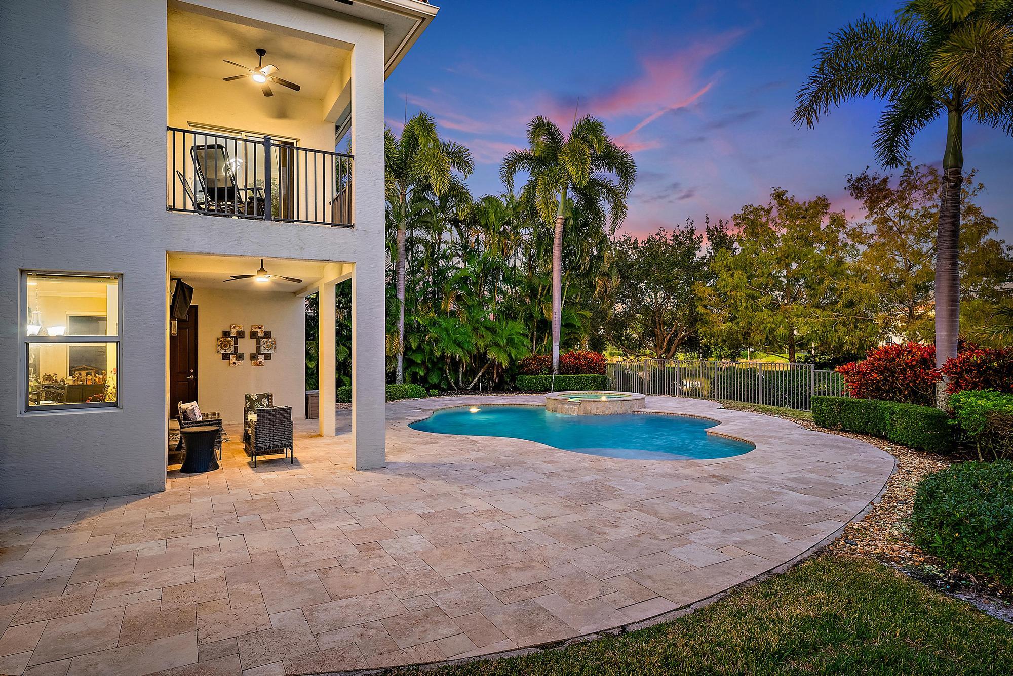 160 Umbrella Place Jupiter, FL 33458 - Photo 3 of 24 a front view of a house with a yard