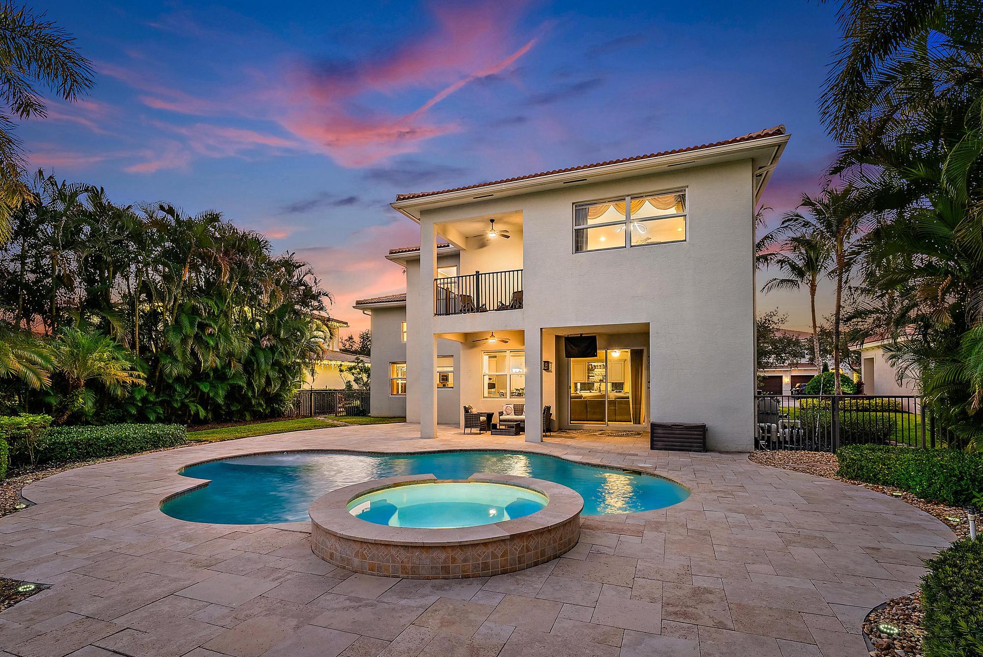 160 Umbrella Place Jupiter, FL 33458 - Photo 5 of 24 a front view of a house with a yard