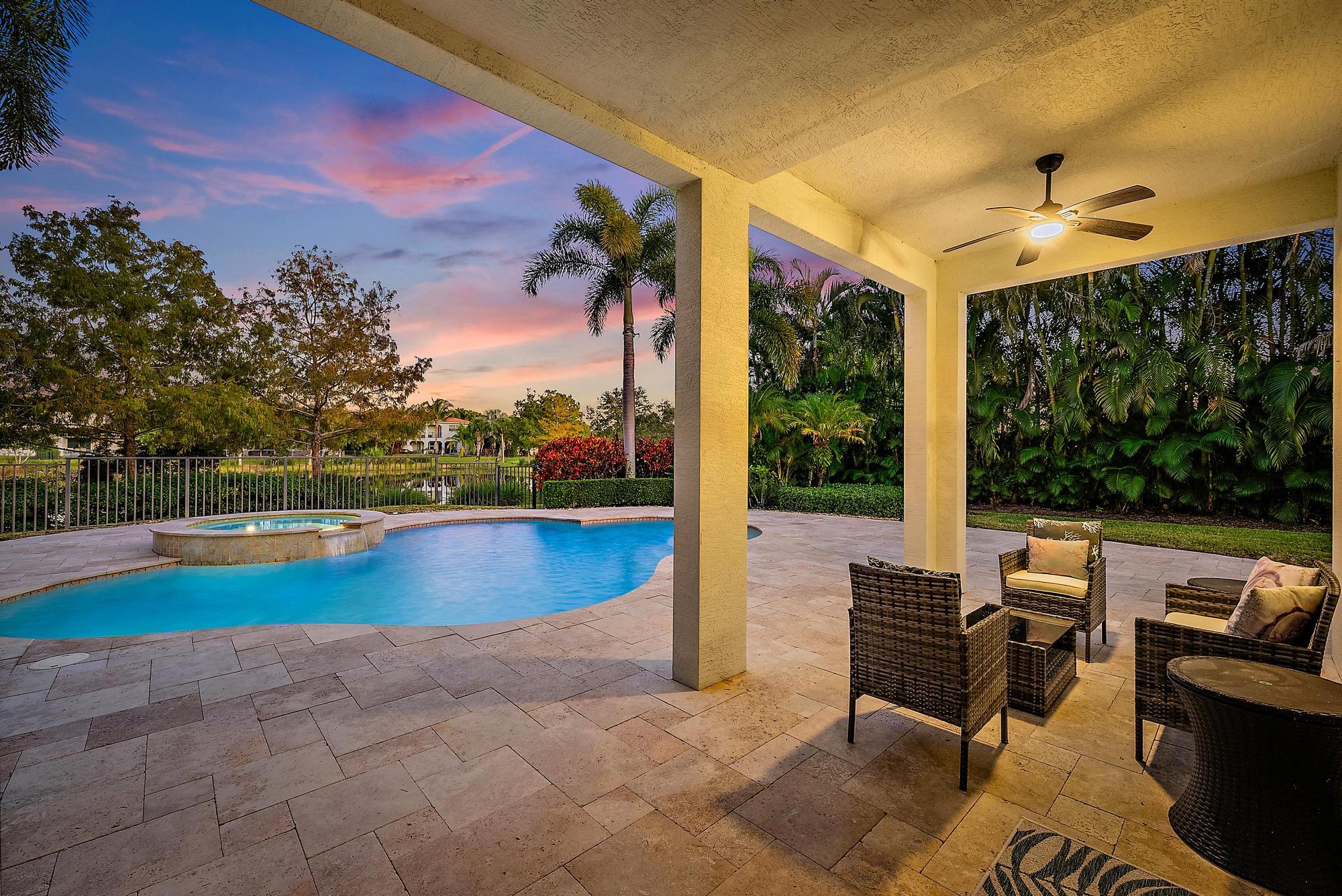 160 Umbrella Place Jupiter, FL 33458 - Photo 7 of 24 a view of a patio with swimming pool and sitting area
