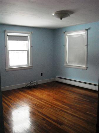 488 Edgell Road Framingham, MA 01701 - Photo 3 of 4 an empty room with wooden floor and windows