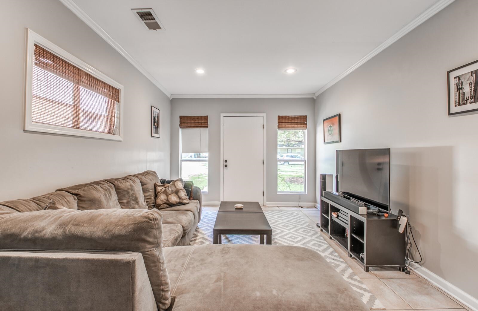 1377 Marcia Road Memphis, TN 38117 - Photo 12 of 24 a living room with furniture and a flat screen tv
