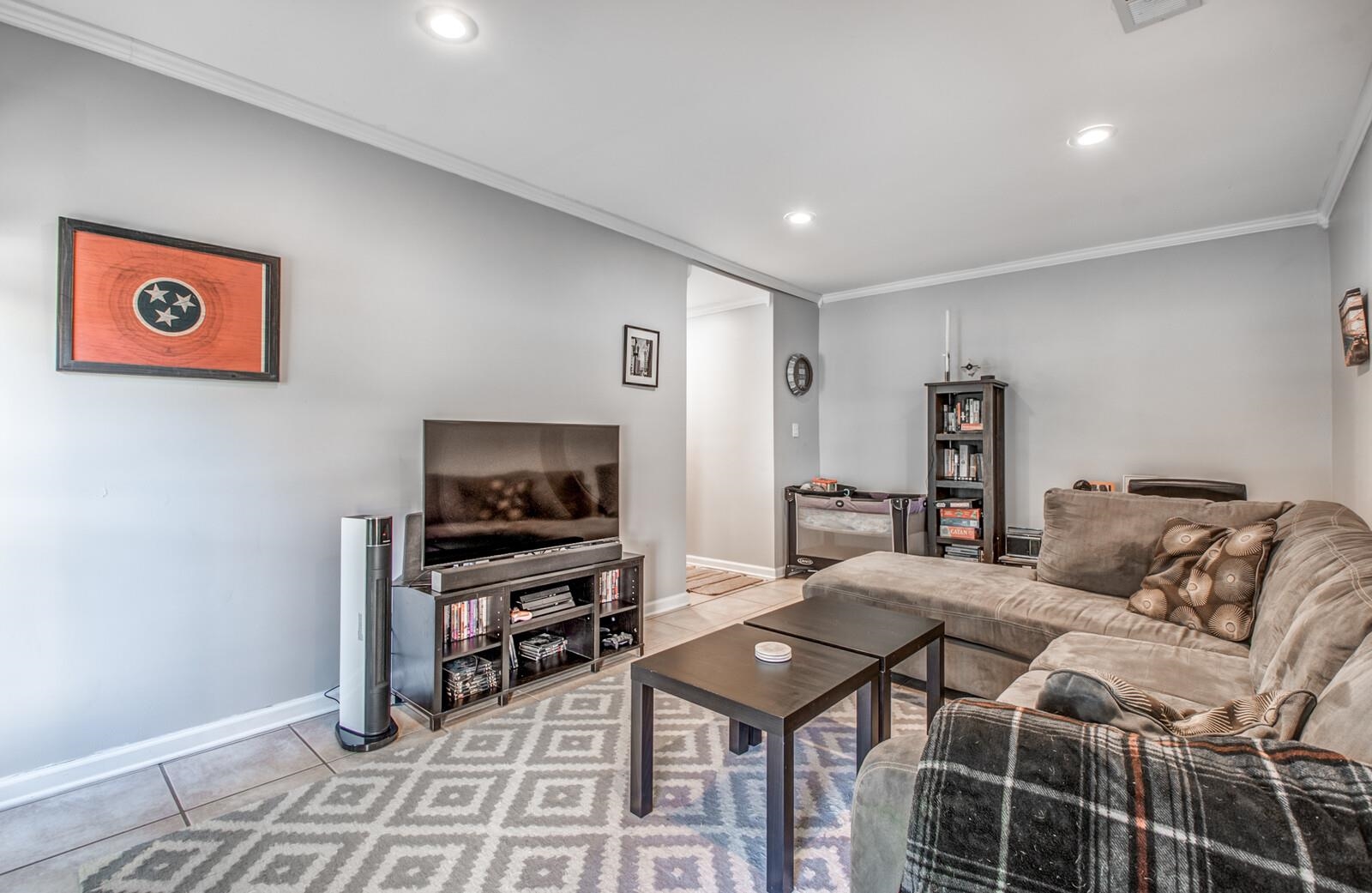 1377 Marcia Road Memphis, TN 38117 - Photo 13 of 24 a living room with furniture and a flat screen tv