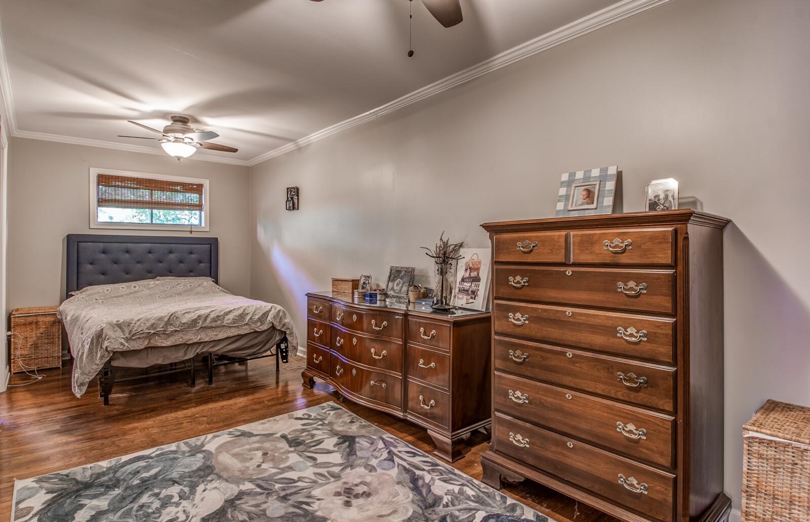1377 Marcia Road Memphis, TN 38117 - Photo 14 of 24 a bedroom with a bed and a chandelier