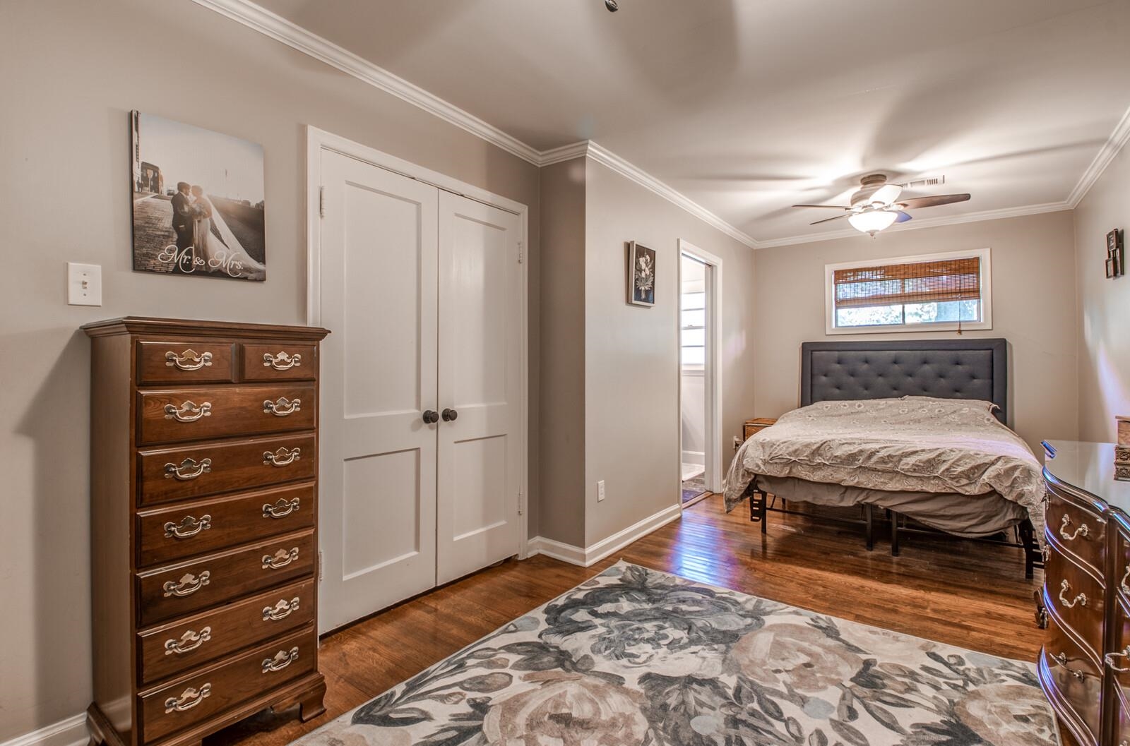 1377 Marcia Road Memphis, TN 38117 - Photo 15 of 24 a bedroom with a bed and a dresser