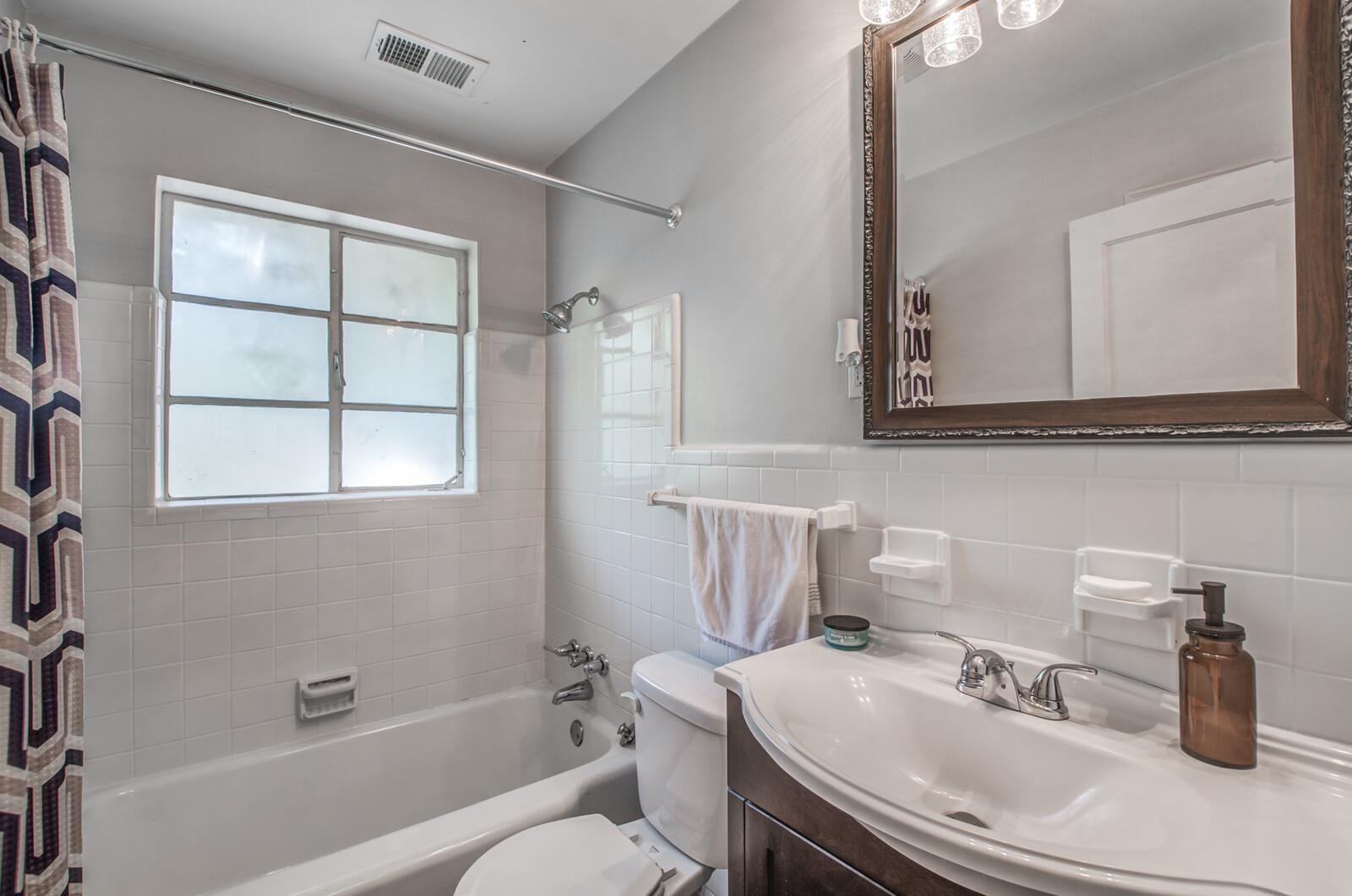 1377 Marcia Road Memphis, TN 38117 - Photo 18 of 24 a bathroom with a sink a toilet and shower