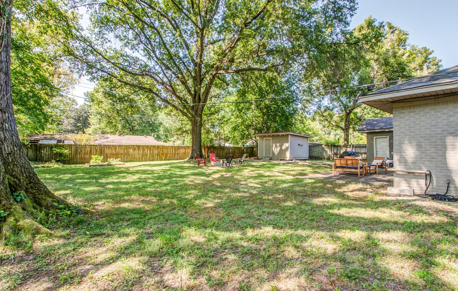 1377 Marcia Road Memphis, TN 38117 - Photo 21 of 24 a front view of a house with a yard
