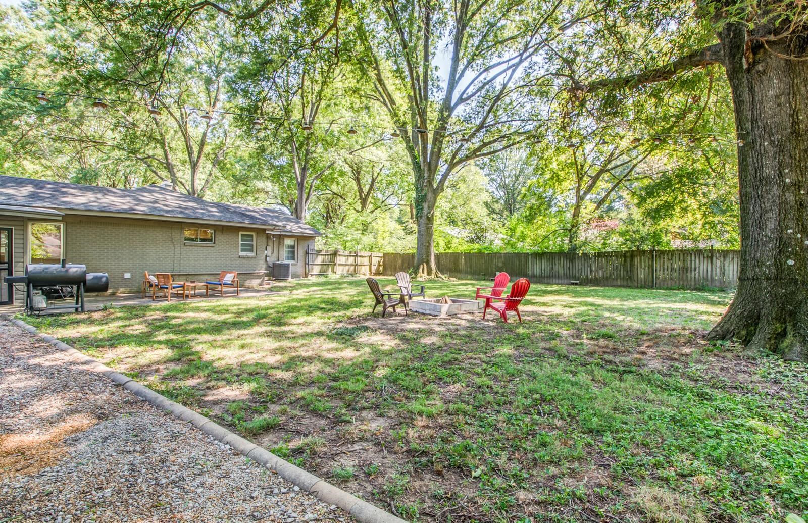 1377 Marcia Road Memphis, TN 38117 - Photo 24 of 24 a view of a house with a backyard and a tree