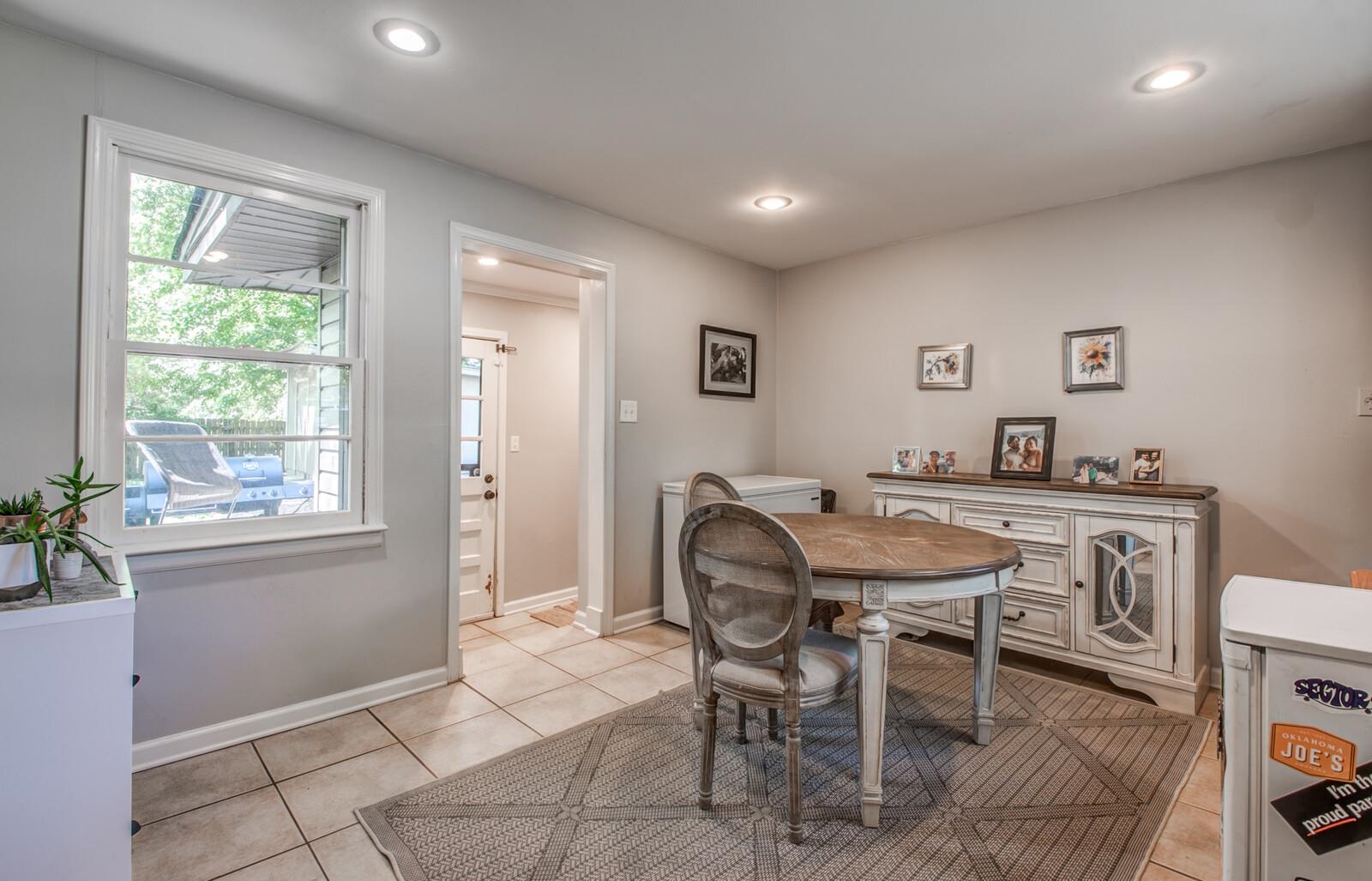 1377 Marcia Road Memphis, TN 38117 - Photo 10 of 24 a view of a dining room with furniture and a window