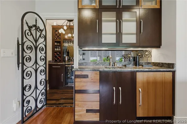 a kitchen with stainless steel appliances granite countertop a refrigerator and a stove
