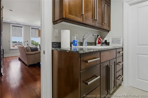 a kitchen with stainless steel appliances granite countertop a refrigerator sink and cabinets