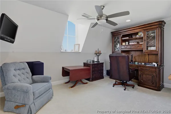a room with furniture and view of bathroom