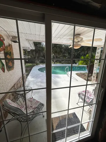 a bed room with furniture and a window