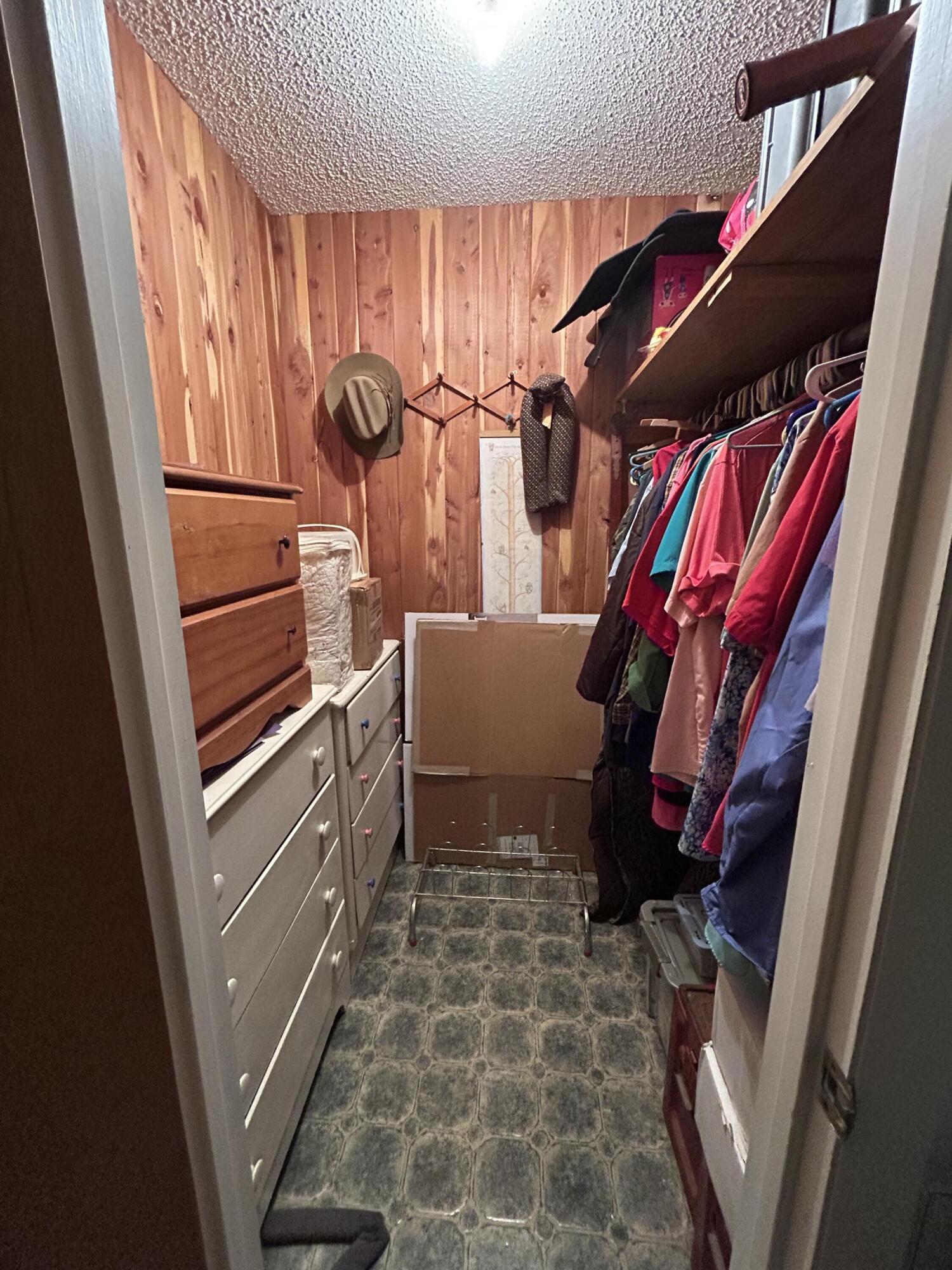 329 Sunflower Lane Freeport, FL 32439 - Photo 17 of 39 a view of walk in closet with clothes and shoes