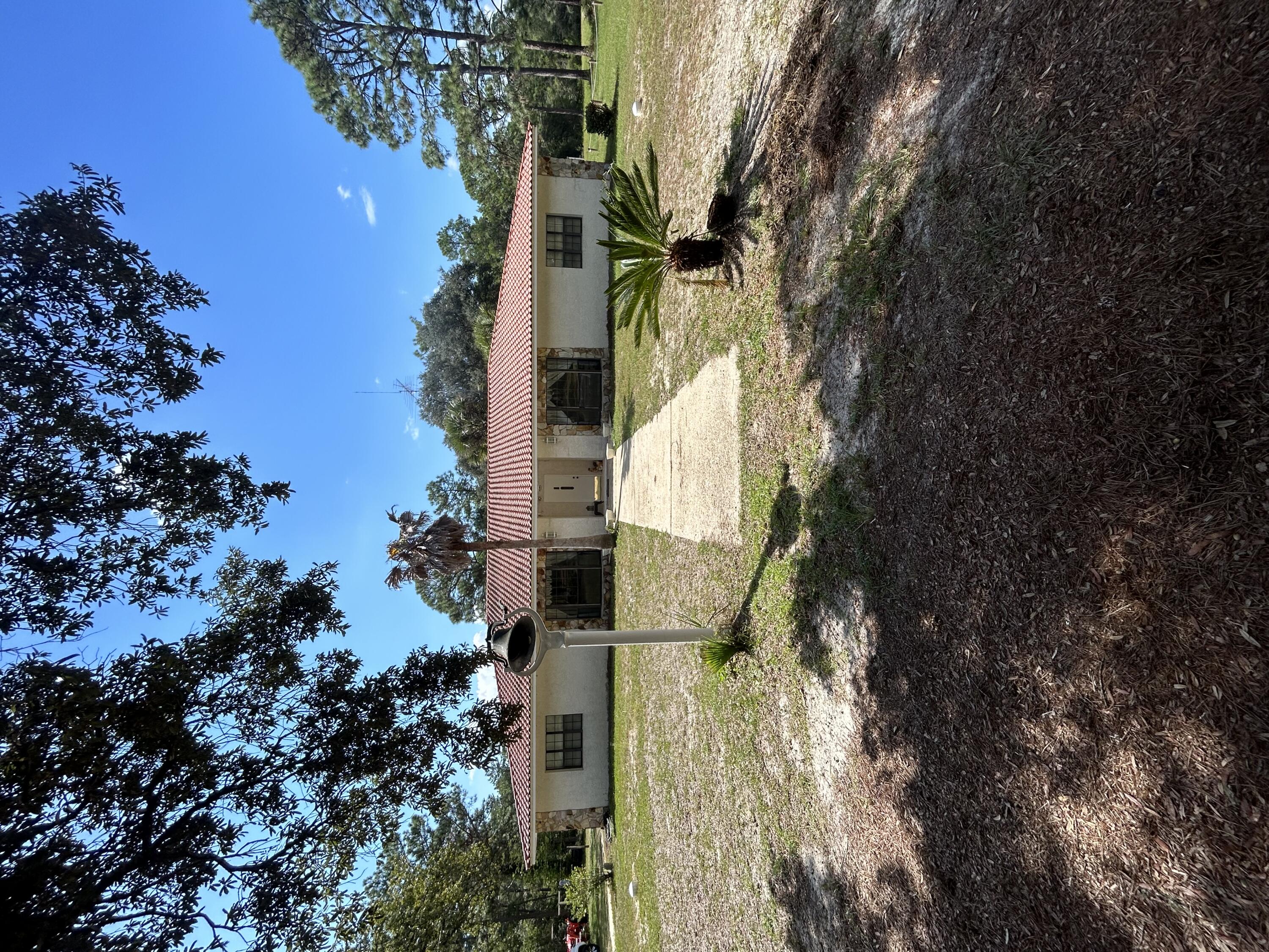 329 Sunflower Lane Freeport, FL 32439 - Photo 2 of 39 a view of a yard with furniture