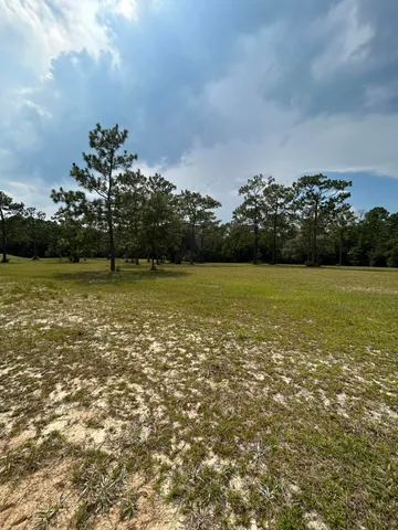 a view of a lake with houses in the back