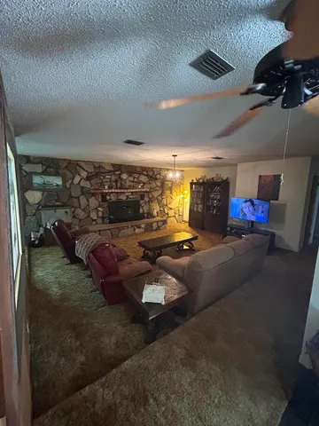 a living room with lots of furniture and a projector