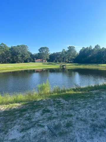 a view of a lake with trees