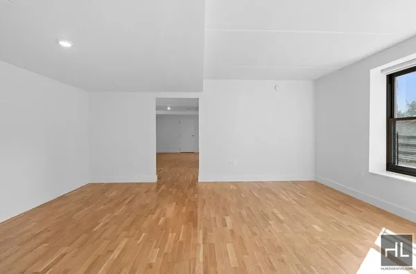 a view of empty room with windows