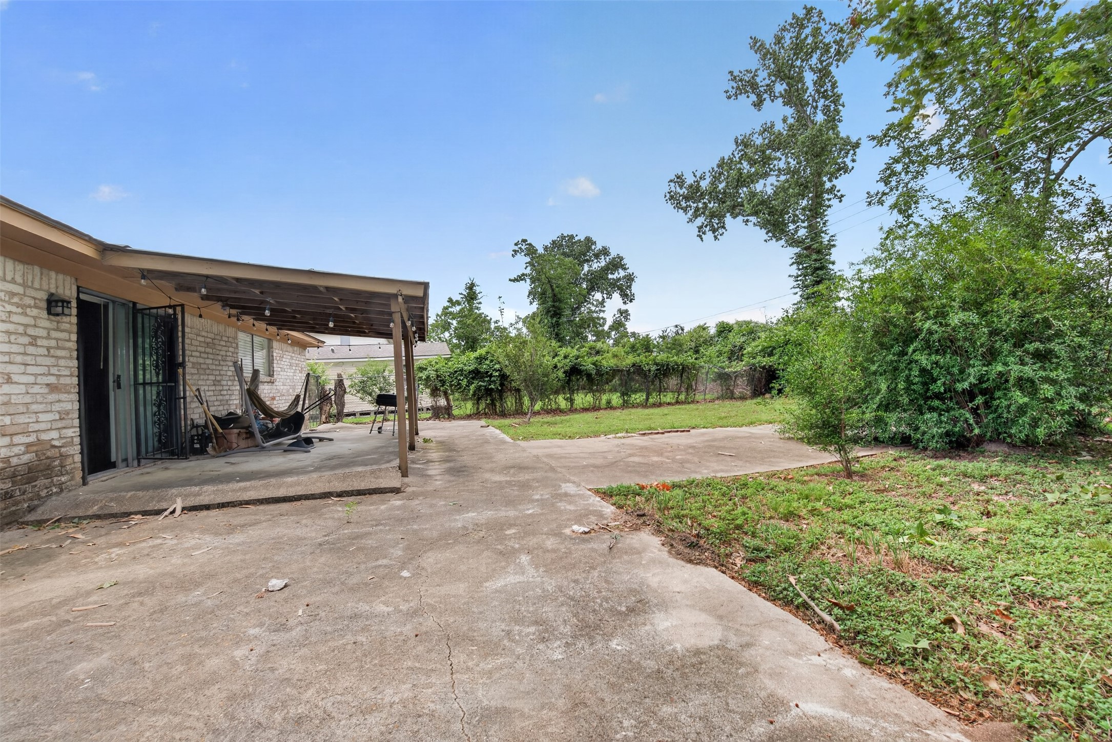 8029 Tareyton Lane Houston, TX 77075 - Photo 20 of 20 a view of a house with backyard and a garden