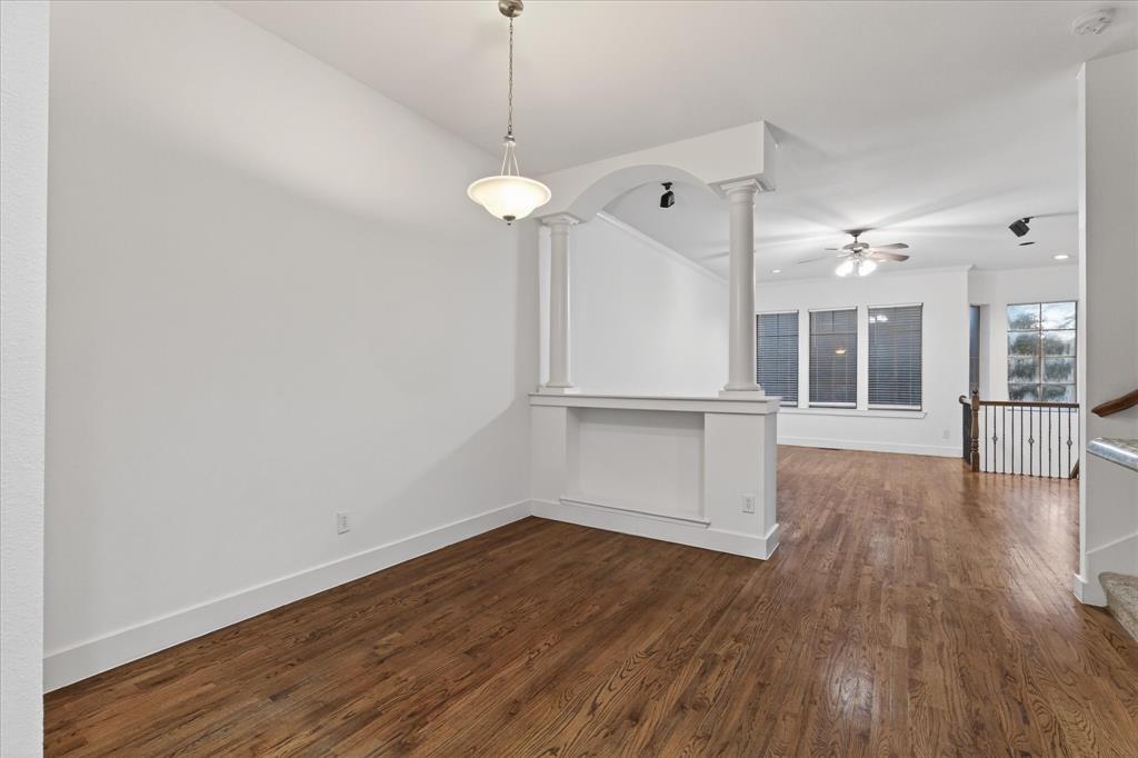 4105 Lafayette Street Dallas, TX 75204 - Photo 14 of 26 a view of a room with wooden floor and large windows