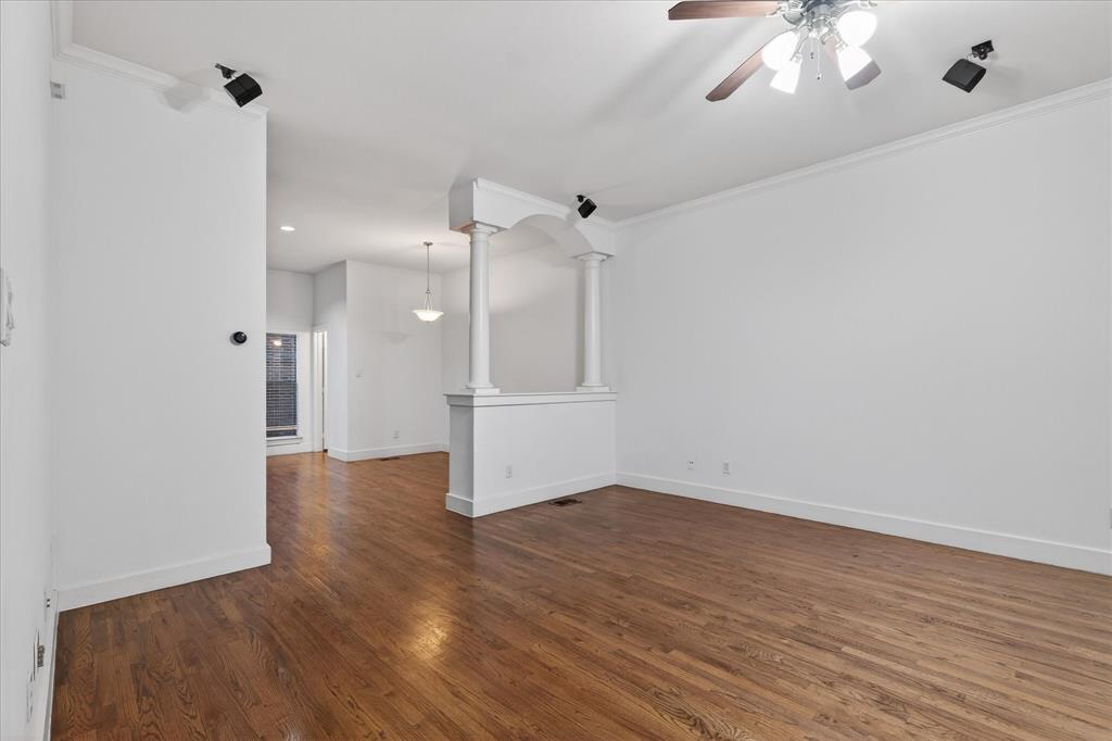 4105 Lafayette Street Dallas, TX 75204 - Photo 8 of 26 a view of a room with wooden floor and a ceiling fan