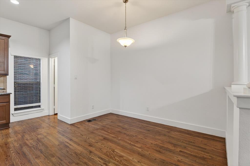 4105 Lafayette Street Dallas, TX 75204 - Photo 10 of 26 a view of a room with wooden floor and white walls