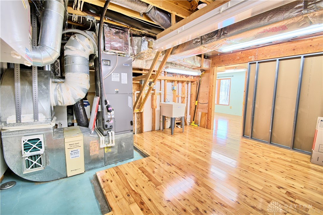 8711 Nicole Lane Springboro, OH 45066 - Photo 73 of 87 This spacious basement offers a large utility sink and the potential for additional finished living space.