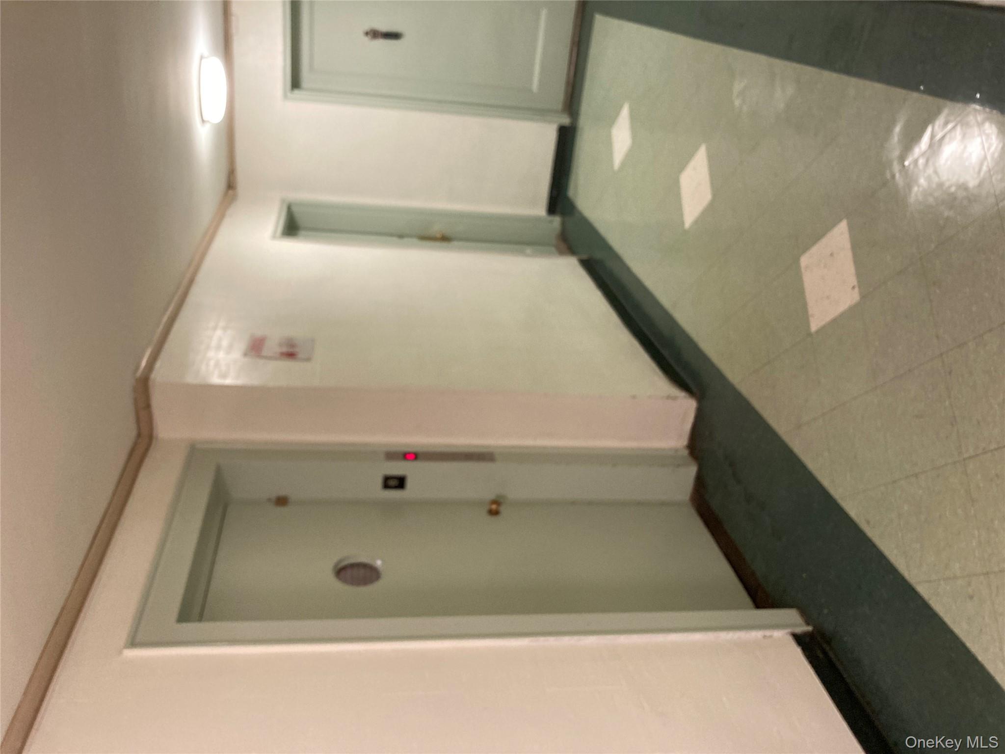 62-59 108th Street, Unit 6E Queens, NY 11375 - Photo 11 of 14 an empty room with wooden floor and closet