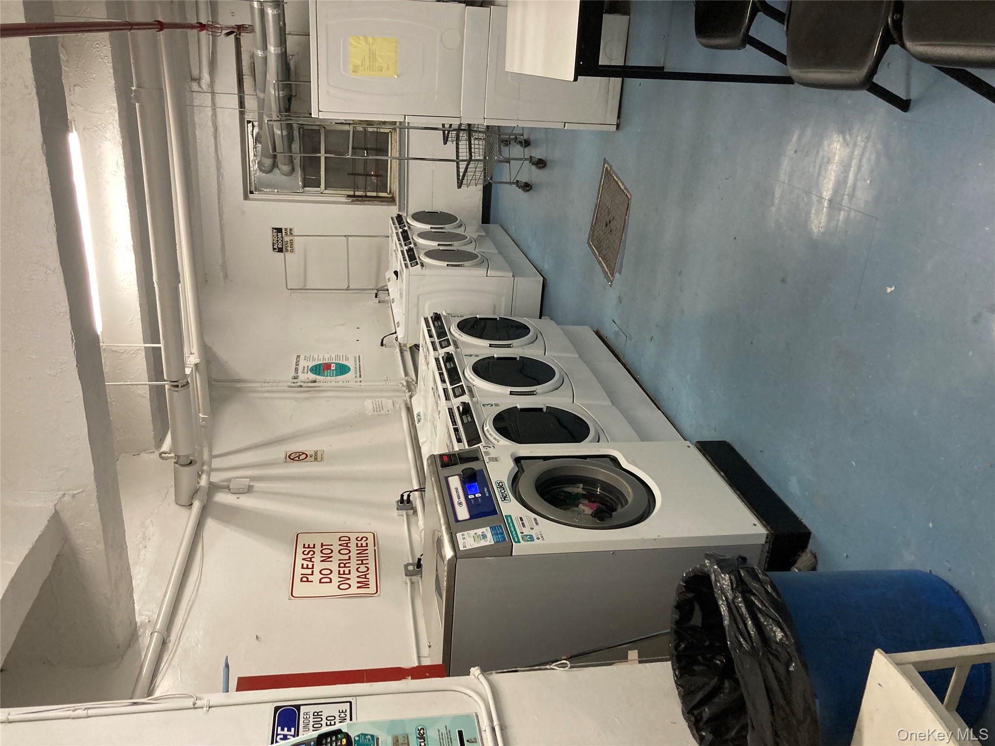 62-59 108th Street, Unit 6E Queens, NY 11375 - Photo 12 of 14 a utility room with dryer and washer