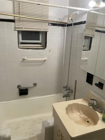 a view of an empty room with windows