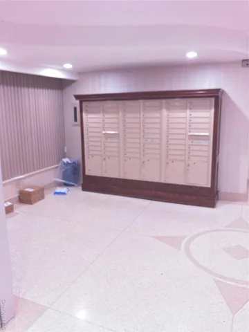 an empty room with wooden floor and closet