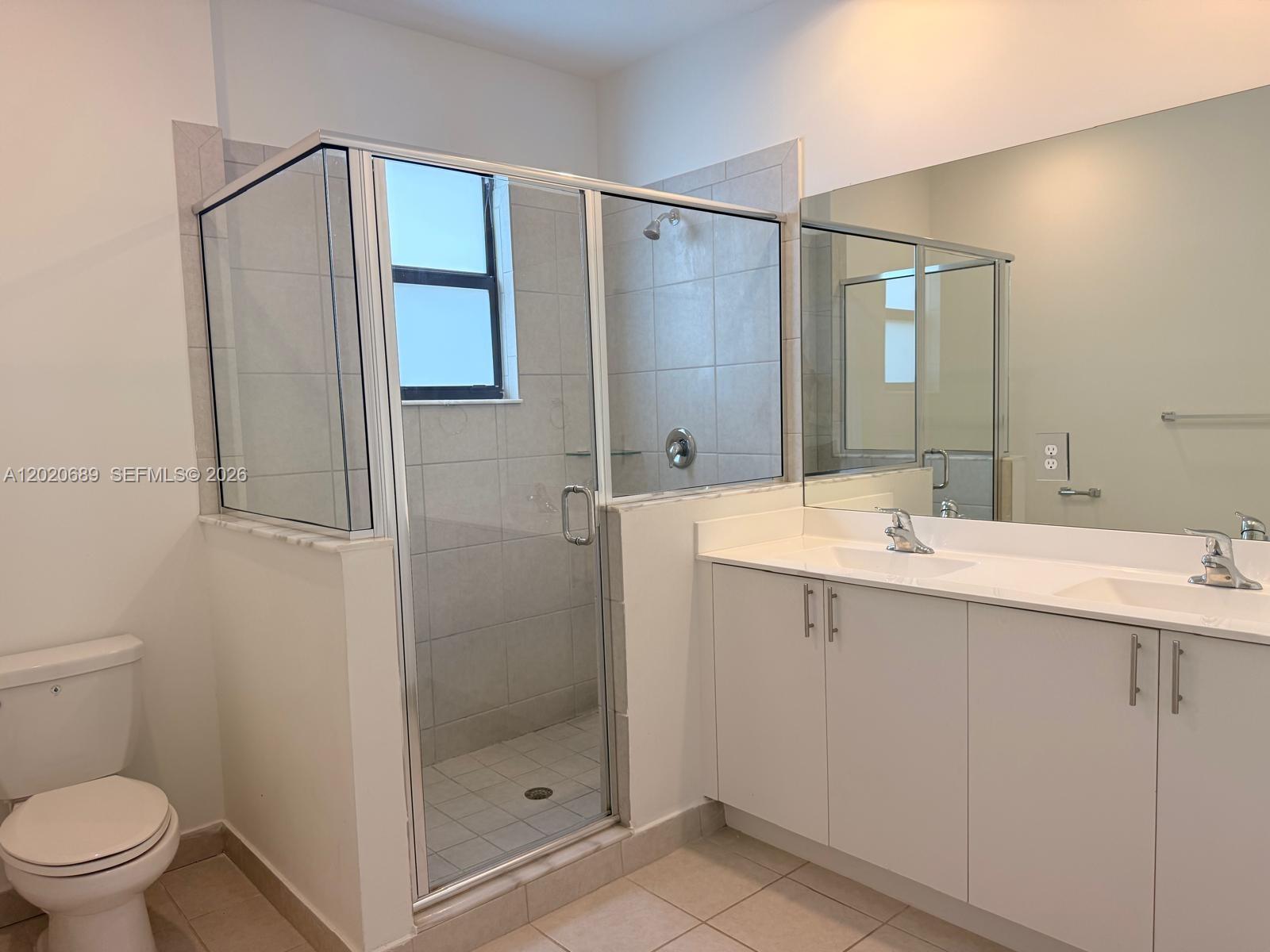 12875 Southwest 231st Terrace Miami, FL 33170 - Photo 15 of 25 a bathroom with a shower sink and mirror