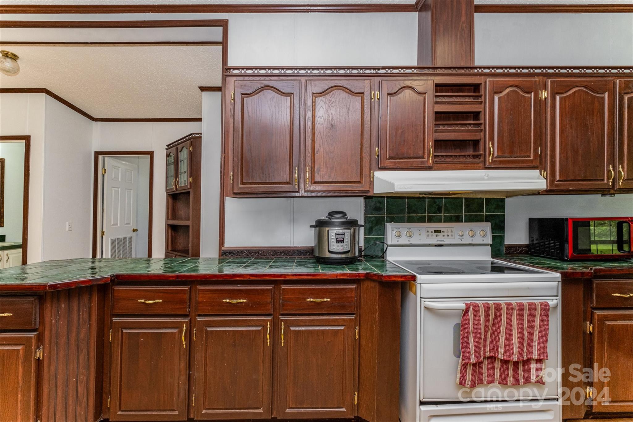1680 Thompson Quarters Road Sharon, SC 29742 - Photo 17 of 37 a kitchen with stainless steel appliances granite countertop a refrigerator and cabinets