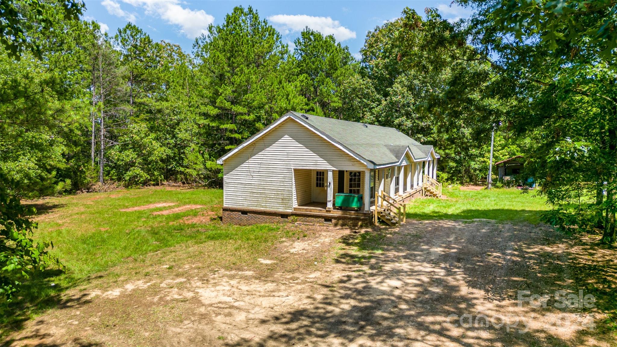 1680 Thompson Quarters Road Sharon, SC 29742 - Photo 7 of 37 a view of a house with backyard and trees