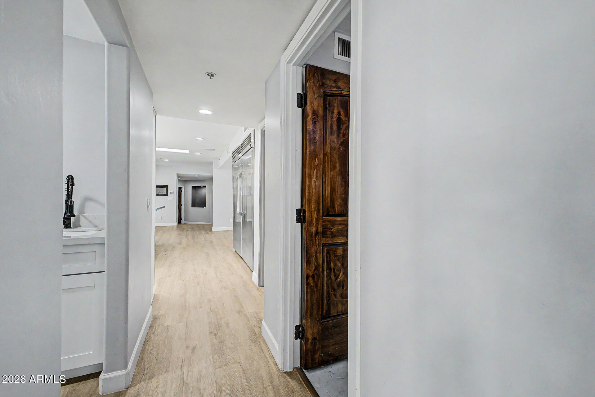 2311 East Colter Street Phoenix, AZ 85016 - Photo 14 of 93 a view of a hallway with wooden floor and staircase