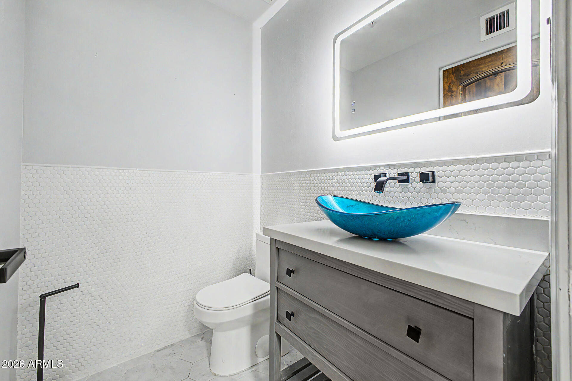 2311 East Colter Street Phoenix, AZ 85016 - Photo 15 of 93 a bathroom with a sink a toilet and mirror